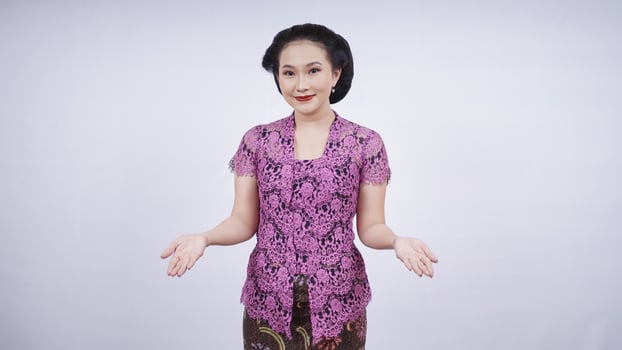 beauty in kebaya smiling welcome gesture isolated on white background photo