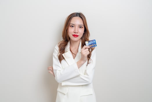 portrait beautiful Asian woman holding credit card photo