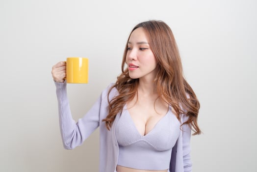 portrait beautiful Asian woman holding coffee cup or mug photo