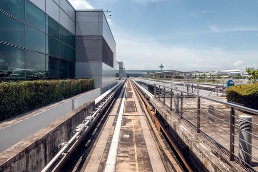 Airport electric train on railway in the terminal photo