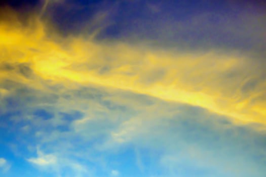 Yellow clouds in the blue sky photo