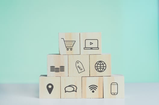 Wooden cubes with shopping online and marketing symbol on background and copy space. photo
