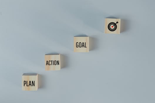 Wooden cubes with plan action goal symbol on background and copy space.Business concepts. photo