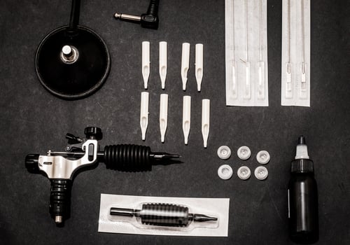 Accessories for tattoo, tattoo artist tools in salon photo