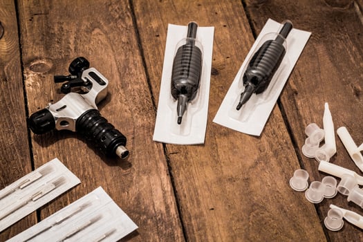 Accessories for tattoo, tattoo artist tools in salon photo