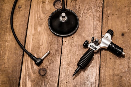 Accessories for tattoo, tattoo artist tools in salon photo