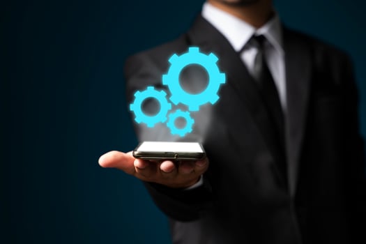 Image of businessman showing gear elements. Mechanism concept photo