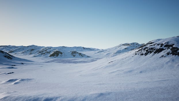 Aerial Landscape of snowy mountains and icy shores in Antarctica photo
