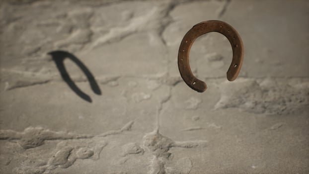 extreme slow motion old rusty metal horseshoe photo