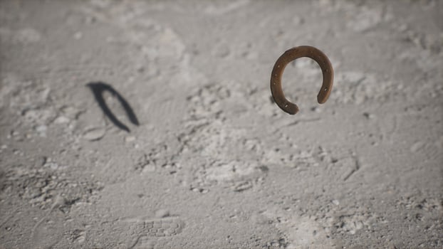 extreme slow motion old rusty metal horseshoe photo