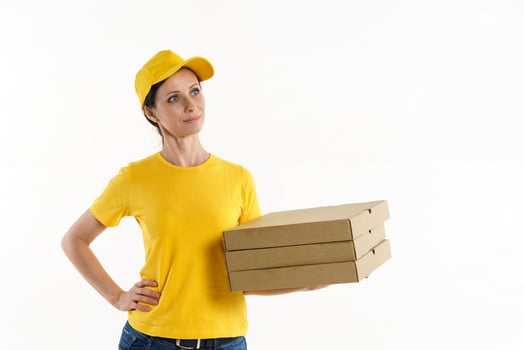 Woman delivery woman in yellow uniform on white background photo