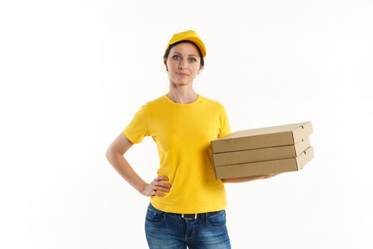 Woman in yellow pizza delivery girl on white background photo