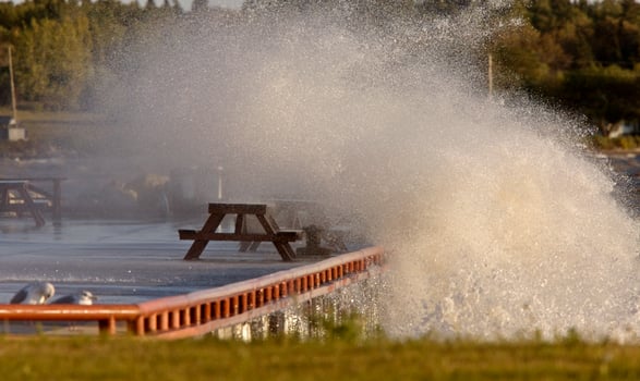 Waves crashing over pier Lake Winnipeg Manitoba photo