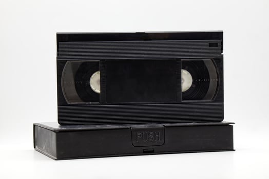 Vintage VHS video tape cassette with plastic cassette box. Retro style technology from the 90s photo