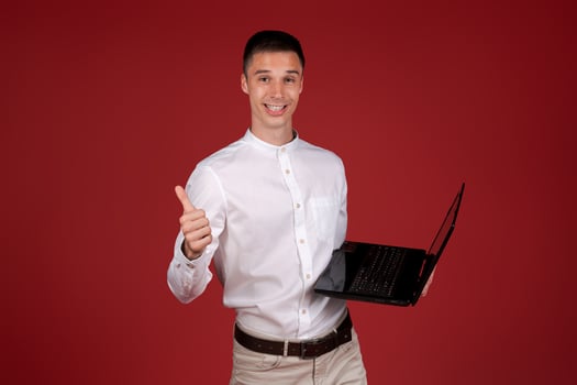 Young smiling successful businessman caucasian male in white shirt index finger photo