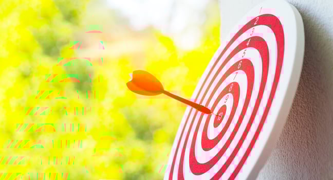 Close-up red dart arrow hitting in target center of dartboard   Business goal or success goal marketing Strategy and business competition concept photo