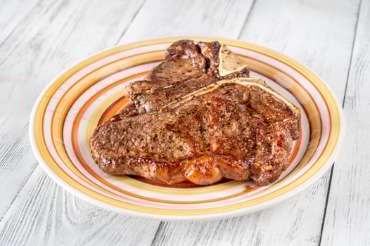 Pan-fried T-bone steak photo