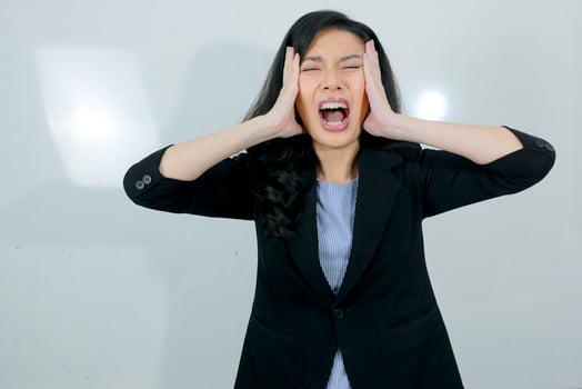 Business young asian girl is stress and confuse about her work isolated on white background photo