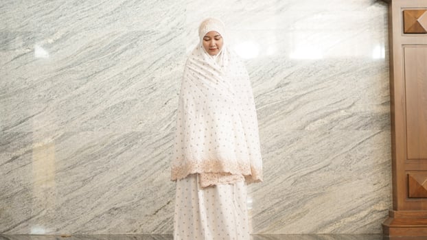 Asian Muslim women praying at the mosque photo