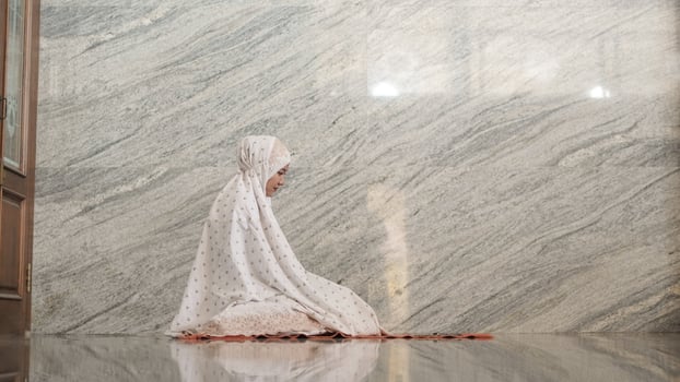 Asian Muslim women praying at the mosque photo