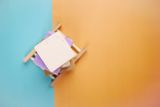 Homemade natural soap bar on color background photo