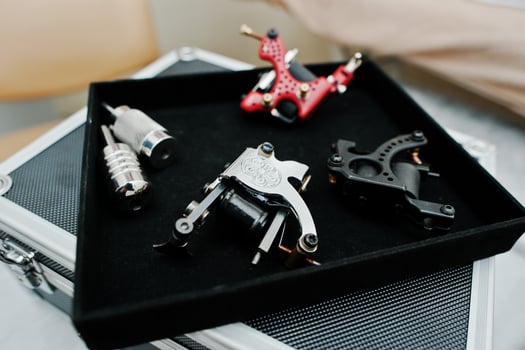 Set of tattoo machines and devices at black box photo