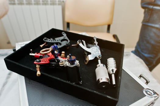 Set of tattoo machines and devices at black box photo