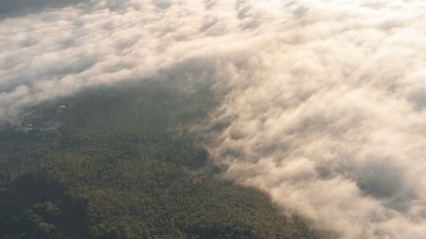 Sea of Fog covers the area on the top of hill Doi Phu Thok, Chiang Khan, Loei, Thailand with background of sunrise on winter. photo
