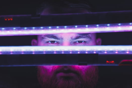 Neon light portrait of man model with mustaches photo