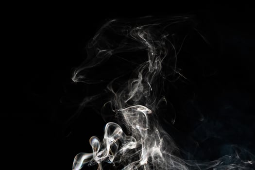 Smoke effect texture. Isolated background. Black and dark backdrop. Smokey fire and mistic effect. photo