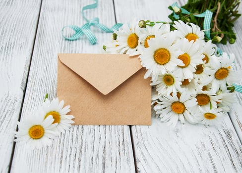 bouquet of daisies with envelope photo