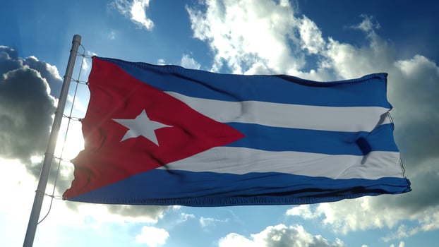 Cuba flag waving in the wind against deep blue sky. National theme, international concept. 3d rendering photo
