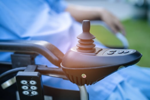 Asian senior or elderly old lady woman patient on electric wheelchair with remote control at nursing hospital ward, healthy strong medical concept photo