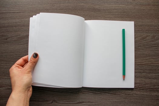hand holding blank book photo