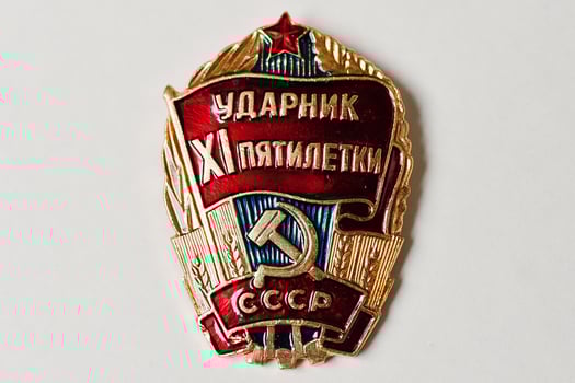 Soviet medal for communist labor five-year plan on white background photo