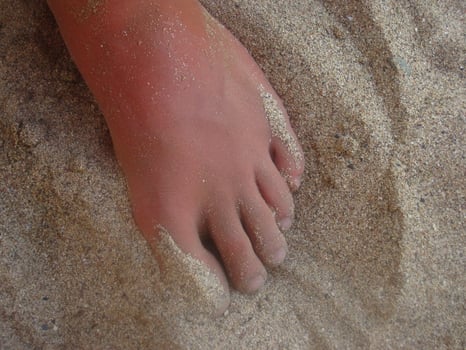 foot in the sand photo