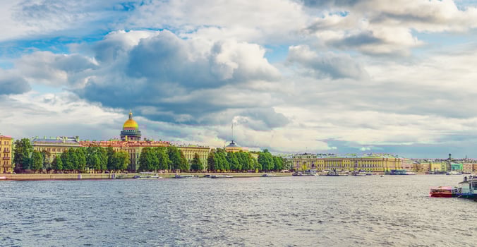 Panorama of Saint Petersburg city with row of old buildings on embankment of Neva river photo