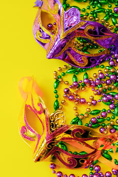 Two carnival masks on yellow background. photo