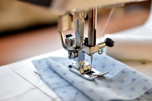 New White sewing machine with threads at home photo
