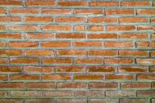 Old grunge dirty brick wall surface. Abstract tiled brick work background and pattern. photo