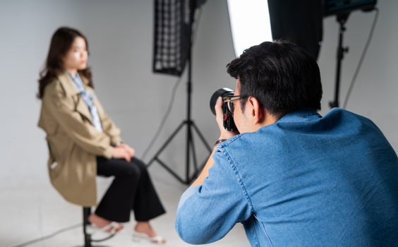 Portrait of young Asian photographer photo