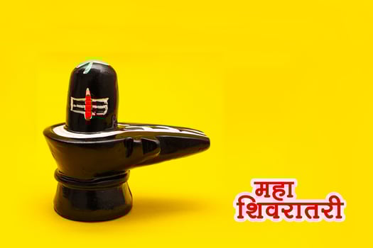 Shiva Linga on yellow background. photo