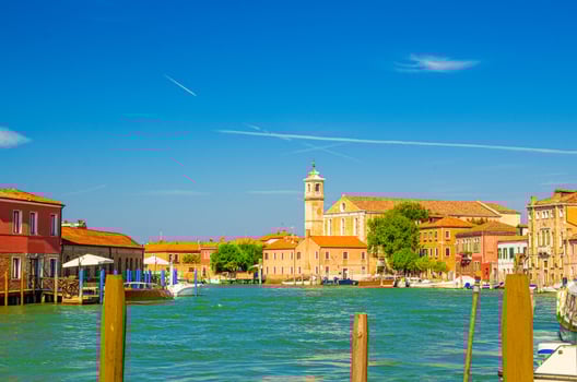 Murano islands water canal with Santa Maria degli Angeli church photo