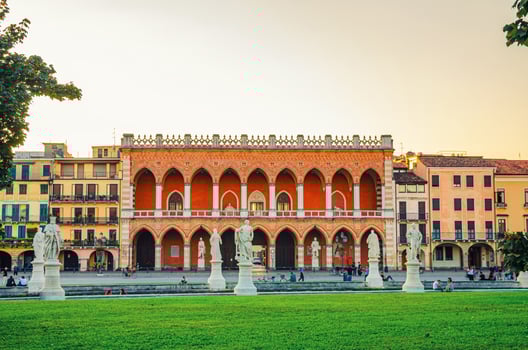 Padua cityscape with Palazzo Loggia Amulea palace neogothic style building and statues photo