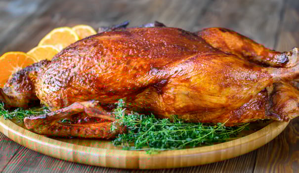 Baked duck on wooden tray photo