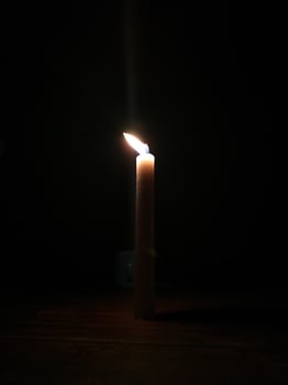Candlelight in the dark night photo