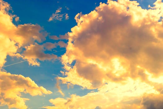 the beautiful sight of the sun shining from behind the clouds photo