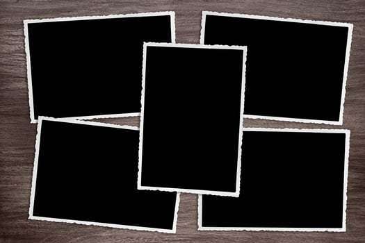 five old vintage photos on wooden background