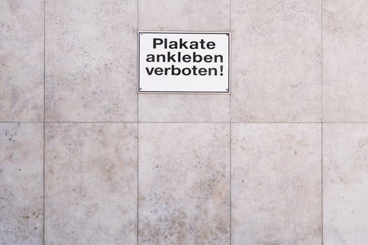 German sign Plakate ankleben verboten translates as post no bills photo