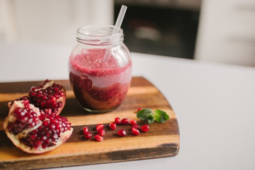 freshly prepared smoothies from banana and pomegranate. Diet, a healthy lifestyle photo